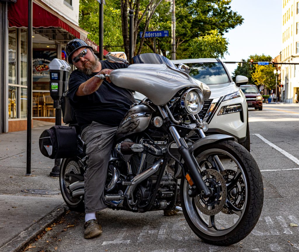 A man gets ready to hit the road on his Yamaha motorcycle.