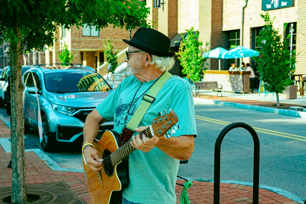 The Peanut Man of downtown Wilmington, NC, playing his guitar.