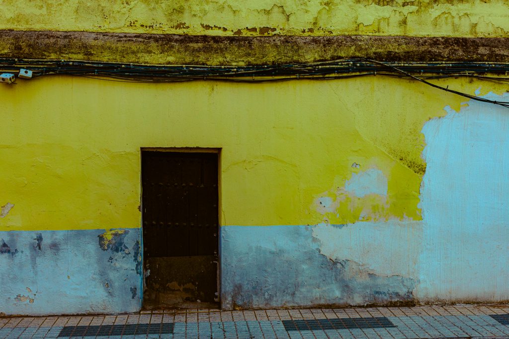 A door in the wall along a street in Mérida, Spain.