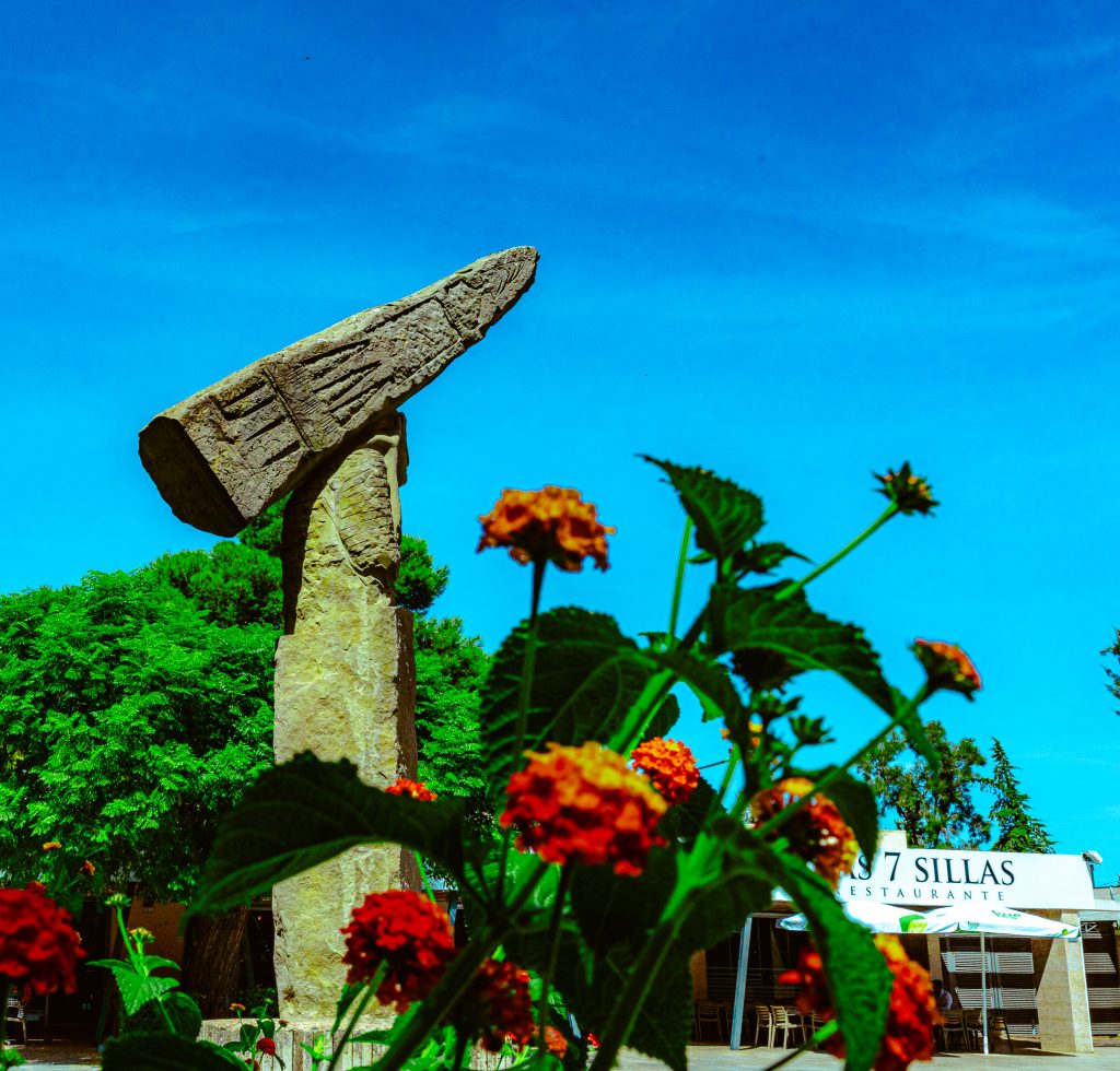 A statue stands outside the Roman Amphitheater in Mérida, Spain.