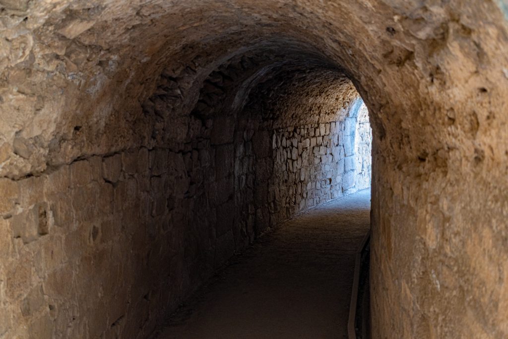 Looking inside a tunnel that runs through the stands of the Roman theater. Mérida, Spain.