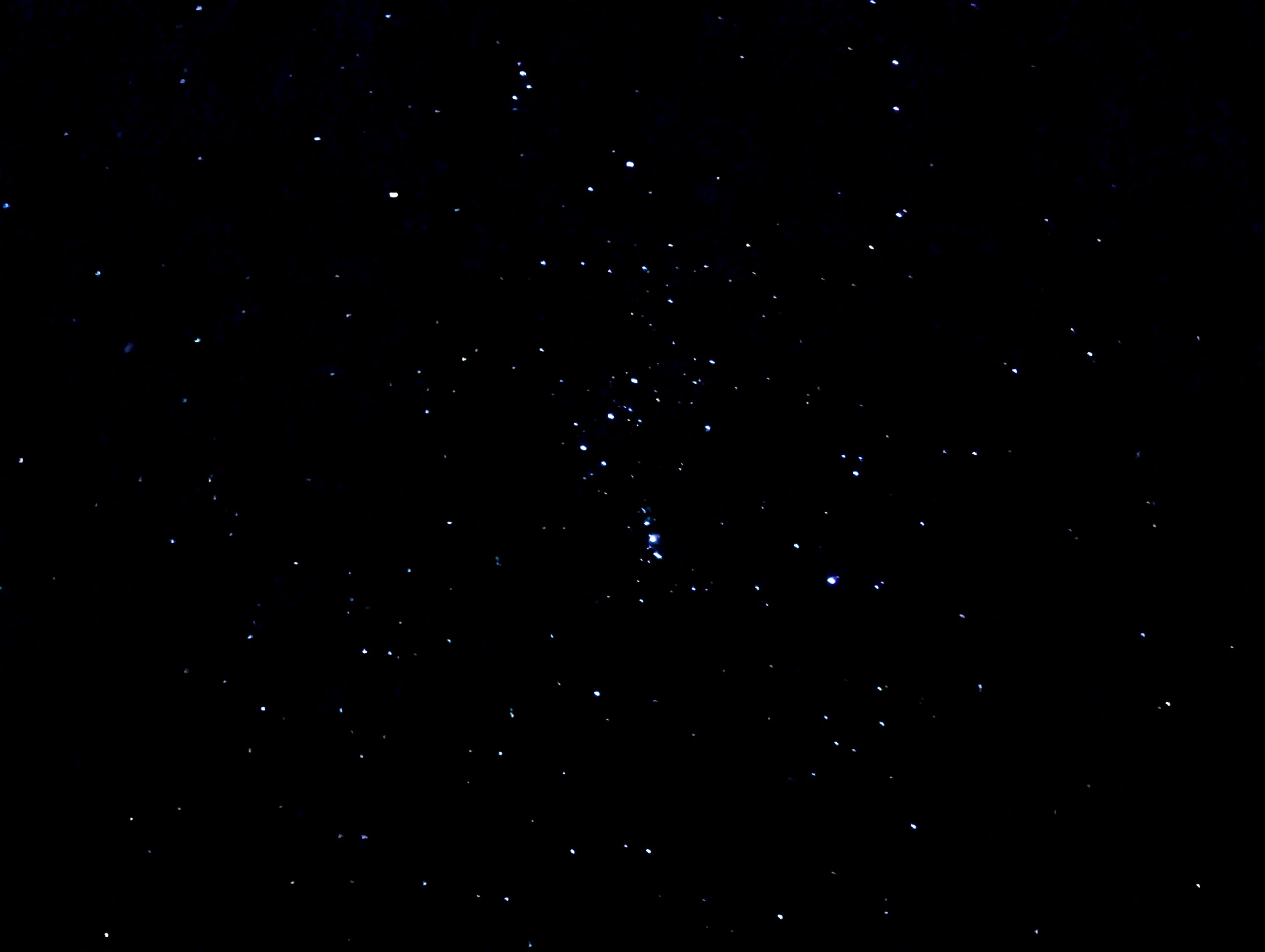 A clear nighttime view of the sky, with the constellation Orion visible.